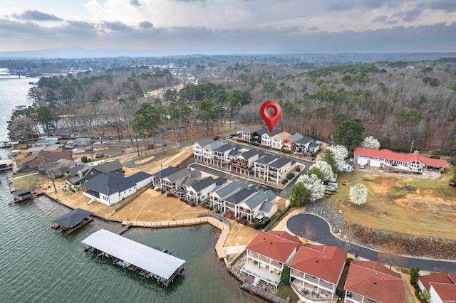 drone / aerial view featuring a residential view and a water view