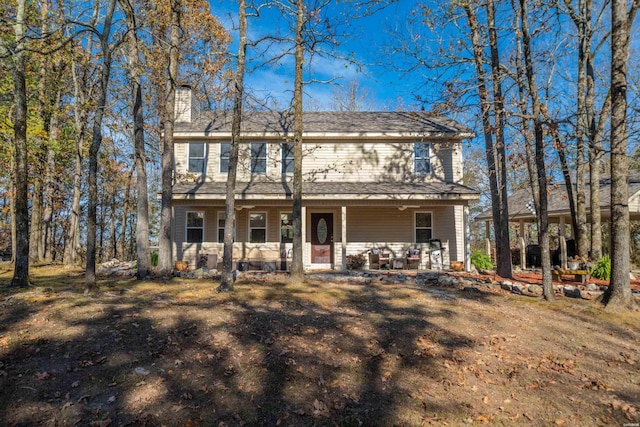 view of front of home featuring a chimney