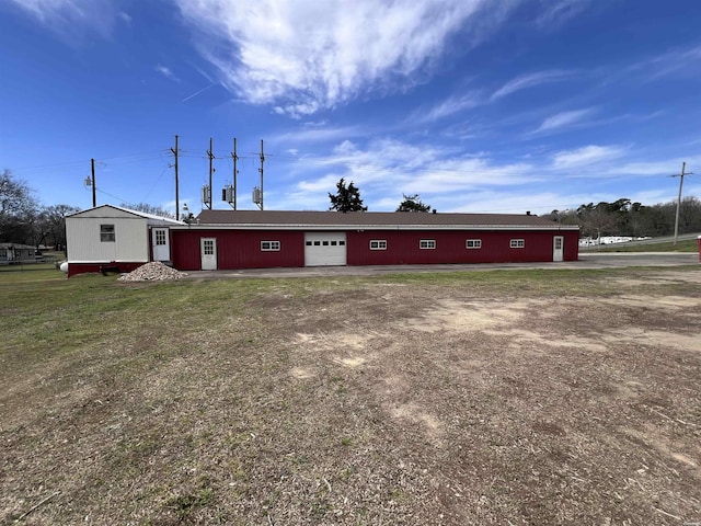 130,133,150 Treasure Isle Road, Hot Springs, AR 71913 - back of house featuring a lawn and an attached garage