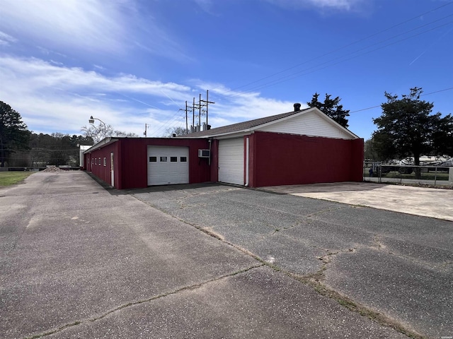 130,133,150 Treasure Isle Road, Hot Springs, AR 71913 - garage featuring a wall unit AC and fence