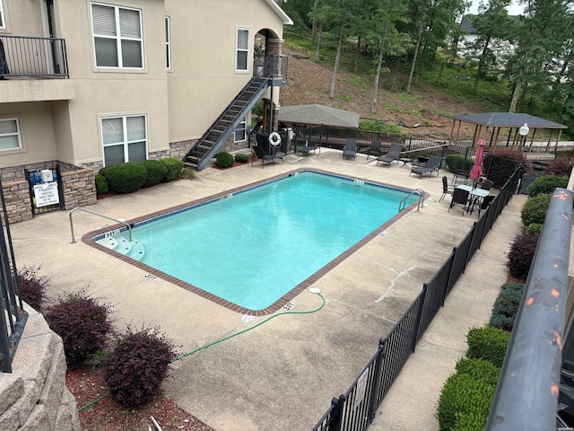 402 Halteria Ln Unit D, Hot Springs, AR 71913 - community pool featuring stairs, a patio area, and a gazebo