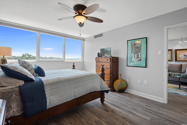 740 Weston Rd # 506, Hot Springs, AR 71913 - bedroom featuring dark wood-type flooring, visible vents, ceiling fan, and baseboards