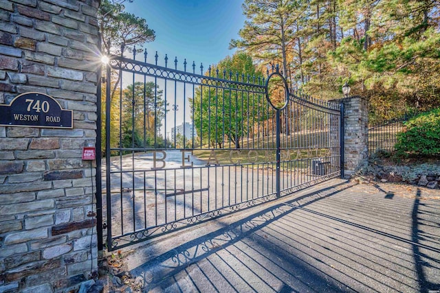 view of gate featuring fence