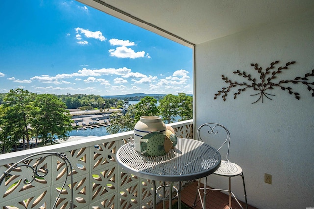 balcony featuring a water view