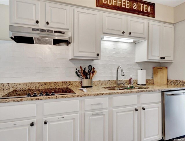 kitchen featuring decorative backsplash, white cabinetry, a sink, dishwasher, and under cabinet range hood