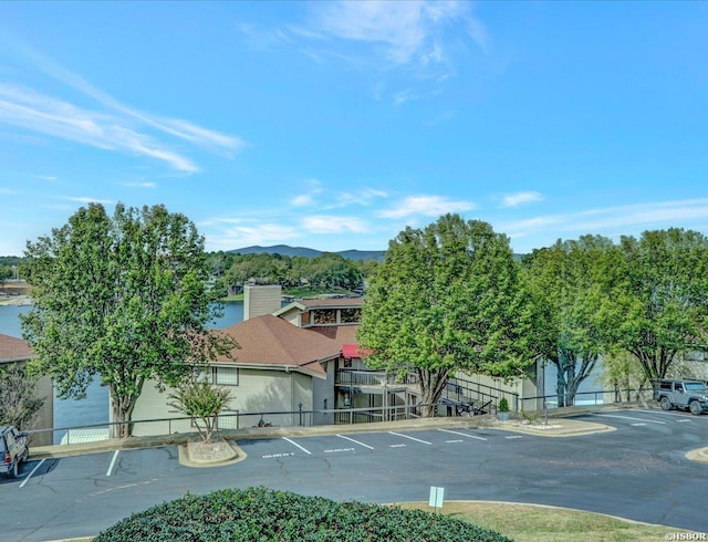 exterior space featuring fence and a mountain view