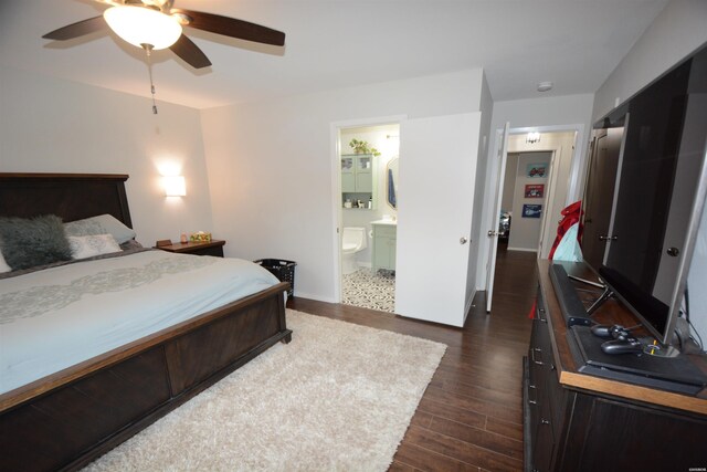 bedroom with dark wood-style floors, connected bathroom, and ceiling fan