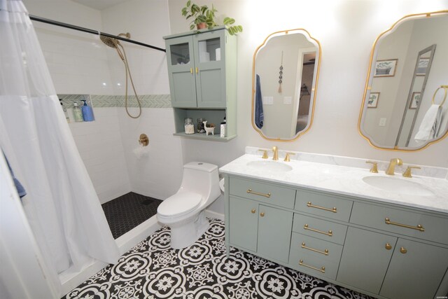 bathroom featuring toilet, a stall shower, a sink, and tile patterned floors