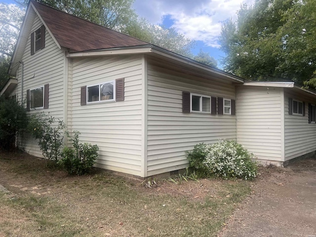 view of side of home featuring crawl space