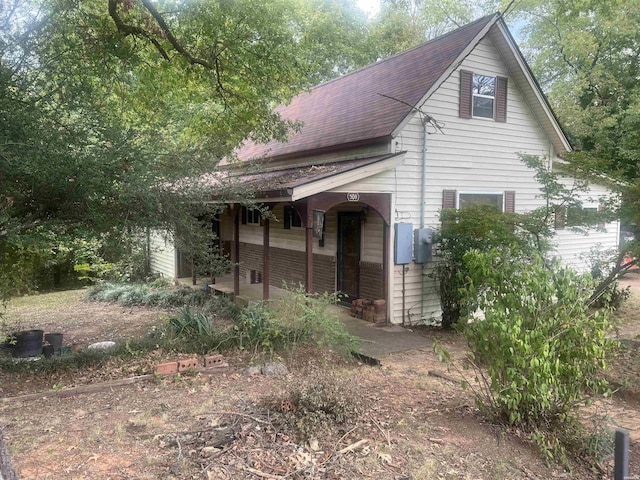 view of front of home featuring roof with shingles