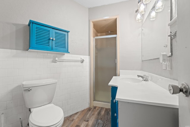 1204 Marion Anderson Rd, Hot Springs, AR 71913 - full bath featuring vanity, toilet, wood finished floors, tile walls, and a stall shower