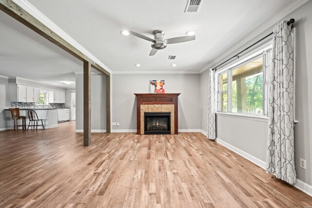 1204 Marion Anderson Rd, Hot Springs, AR 71913 - unfurnished living room with a ceiling fan, light wood-style floors, a fireplace, crown molding, and recessed lighting