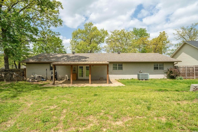 1204 Marion Anderson Rd, Hot Springs, AR 71913 - back of property with french doors, a patio area, central AC unit, a yard, and fence