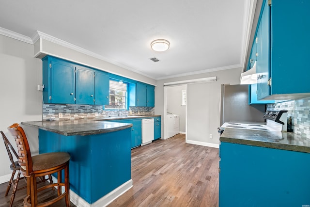 1204 Marion Anderson Rd, Hot Springs, AR 71913 - kitchen with backsplash, electric range, crown molding, white dishwasher, and blue cabinets