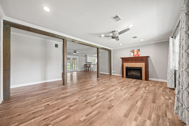1204 Marion Anderson Rd, Hot Springs, AR 71913 - unfurnished living room featuring a ceiling fan, a tiled fireplace, crown molding, light wood finished floors, and recessed lighting