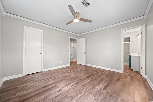 1204 Marion Anderson Rd, Hot Springs, AR 71913 - unfurnished bedroom featuring crown molding, visible vents, and wood finished floors