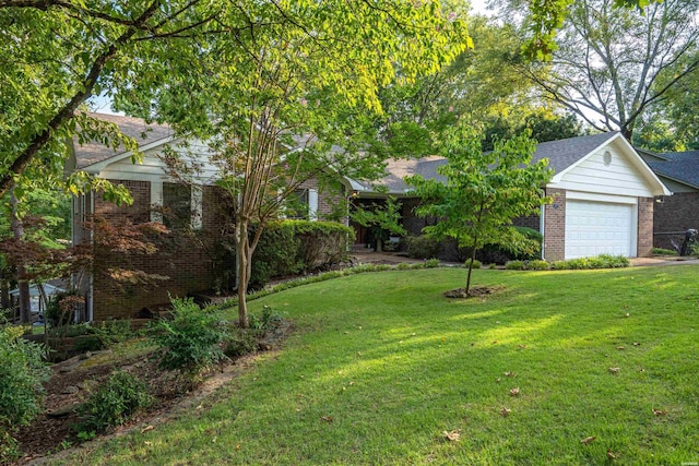 view of yard featuring a garage