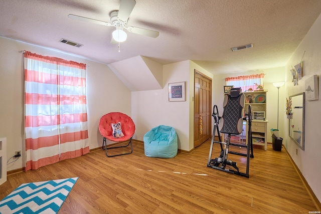 201 Wedgewood Ter, Hot Springs, AR 71901 - workout room with plenty of natural light, a textured ceiling, wood finished floors, a ceiling fan, and baseboards