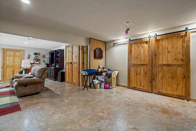 garage featuring baseboards and visible vents