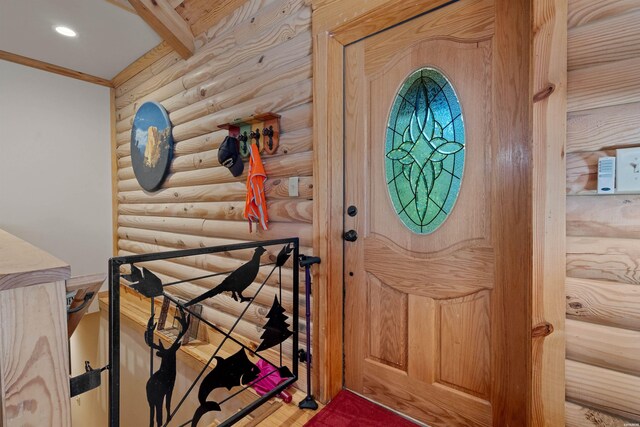 entryway with ornamental molding, recessed lighting, and beamed ceiling