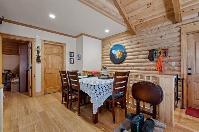 dining room with recessed lighting, ornamental molding, light wood-type flooring, wooden ceiling, and beamed ceiling