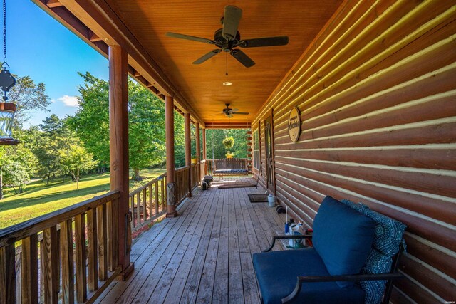 deck featuring a porch and a ceiling fan