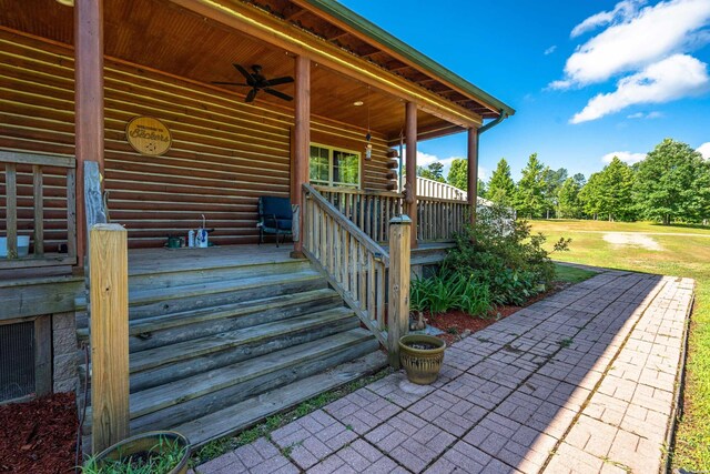 exterior space featuring a ceiling fan