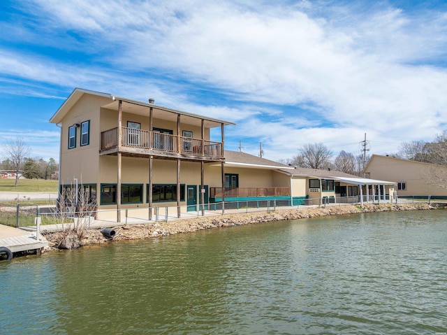 133 Treasure Isle Rd, Hot Springs, AR 71913 - rear view of house with fence, a water view, and a balcony