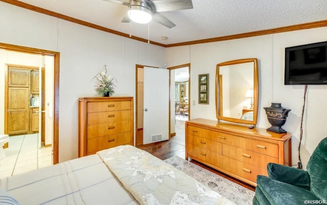 133 Treasure Isle Rd, Hot Springs, AR 71913 - bedroom featuring a ceiling fan, a textured ceiling, ensuite bath, ornamental molding, and visible vents
