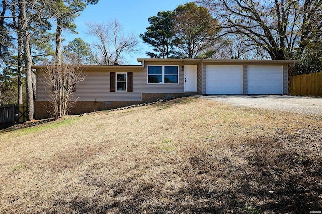 ranch-style home with a garage, crawl space, fence, and dirt driveway