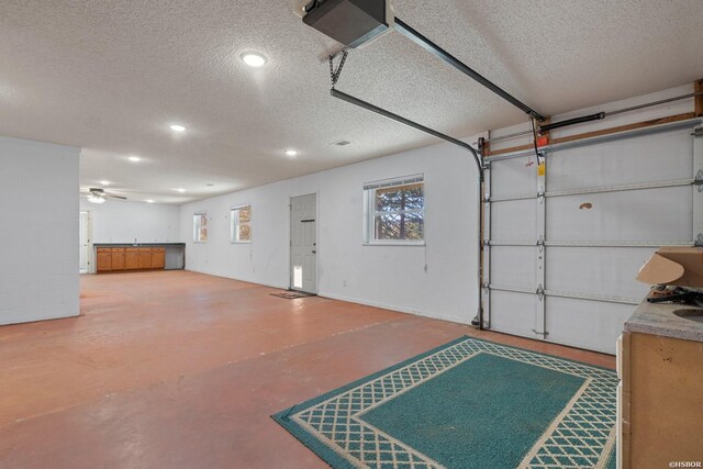 garage with ceiling fan and recessed lighting