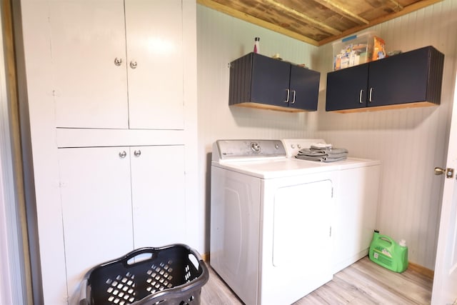 21 Chris Rd, Amity, AR 71921 - washroom with washing machine and clothes dryer, cabinet space, light wood finished floors, wooden ceiling, and wood walls