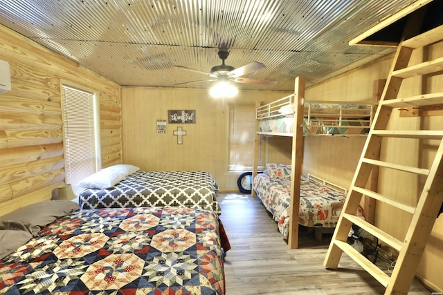 21 Chris Rd, Amity, AR 71921 - bedroom featuring wood finished floors and wooden walls