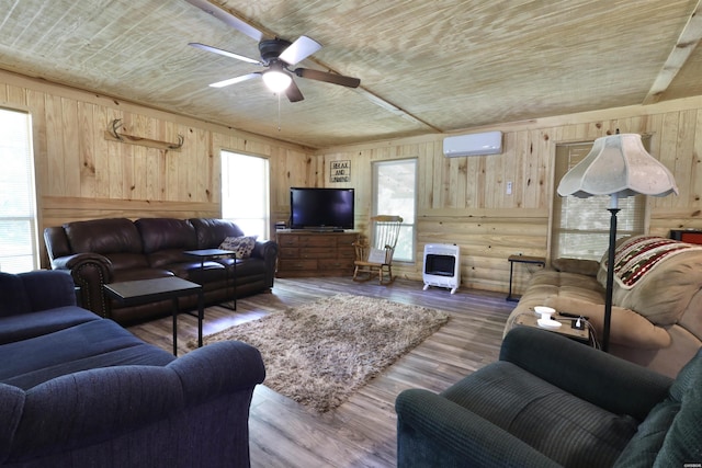 21 Chris Rd, Amity, AR 71921 - living area with a wall unit AC, heating unit, wooden walls, a ceiling fan, and wooden ceiling