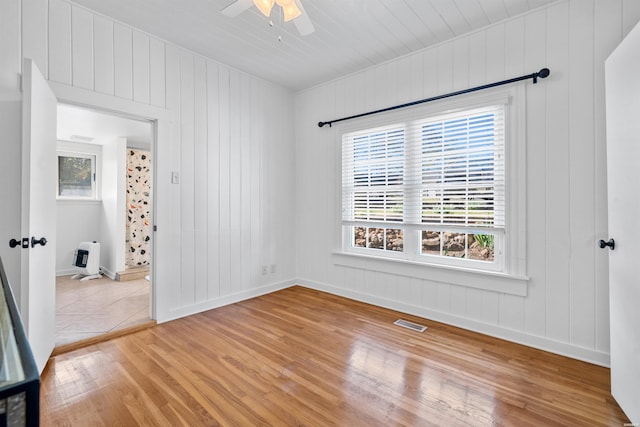 115 Ledgerwood Rd, Hot Springs, AR 71913 - spare room with wood finished floors, a ceiling fan, and plenty of natural light