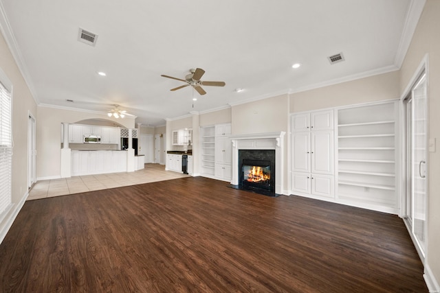 518 Amity Rd Unit E4, Hot Springs, AR 71913 - unfurnished living room with visible vents, recessed lighting, wood finished floors, ceiling fan, and a fireplace