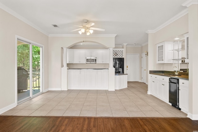 518 Amity Rd Unit E4, Hot Springs, AR 71913 - kitchen featuring a ceiling fan, dark countertops, a sink, black appliances, and visible vents