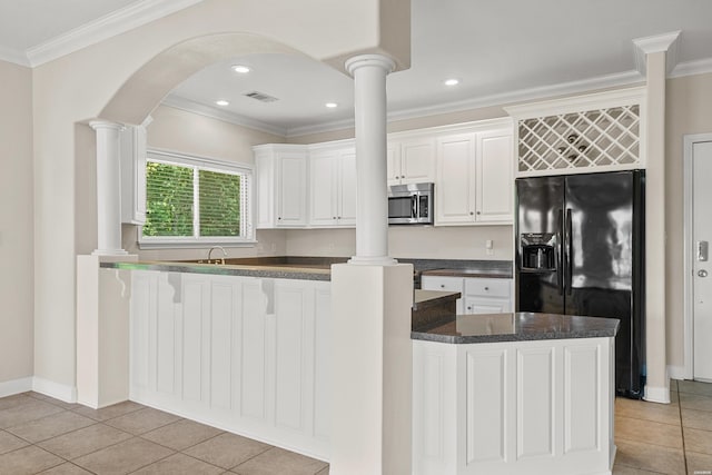 518 Amity Rd Unit E4, Hot Springs, AR 71913 - kitchen featuring dark countertops, black fridge with ice dispenser, stainless steel microwave, ornamental molding, and decorative columns