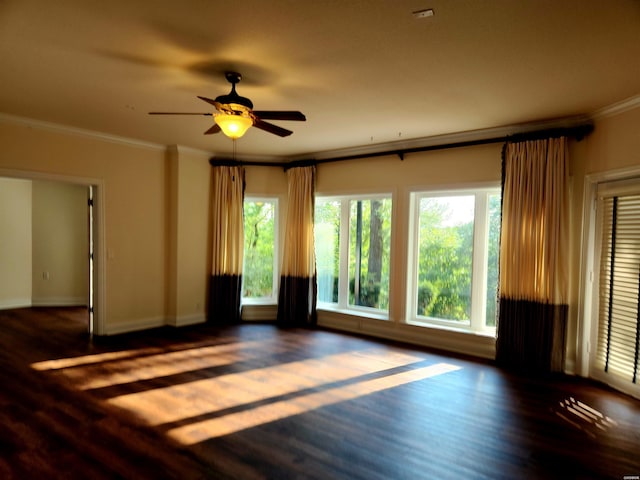 unfurnished living room featuring ceiling fan, baseboards, wood finished floors, and ornamental molding