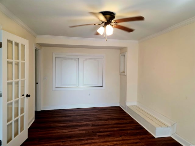 unfurnished room with ornamental molding, baseboards, ceiling fan, and wood finished floors