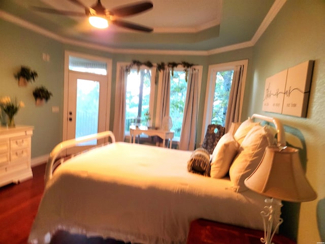 bedroom with a ceiling fan and ornamental molding