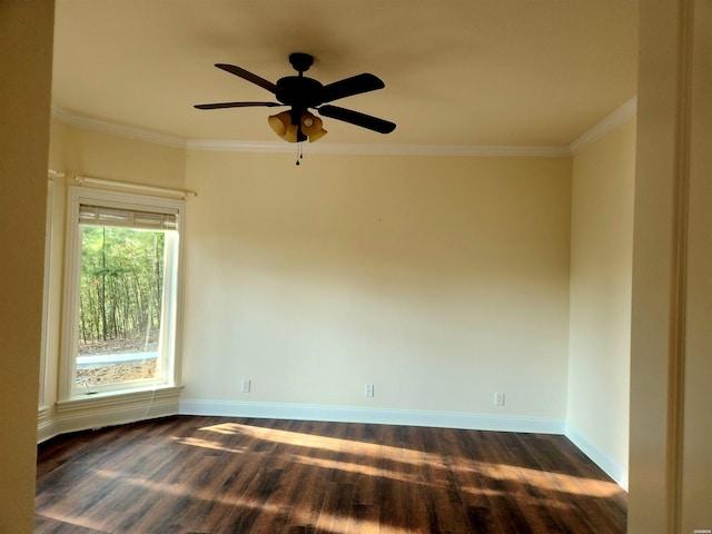 unfurnished room with ceiling fan, baseboards, dark wood-style floors, and crown molding