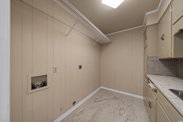 laundry area with cabinet space, baseboards, hookup for a washing machine, marble finish floor, and crown molding