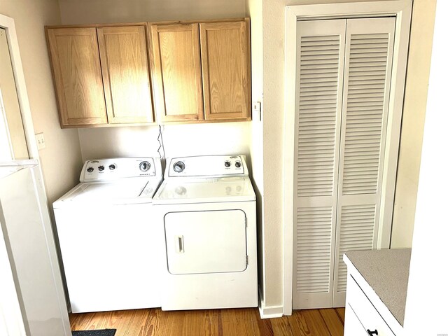 1966 Thomas Loop, Bismarck, AR 71929 - laundry room featuring independent washer and dryer and light wood-style flooring