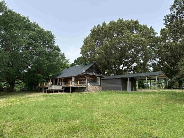 1966 Thomas Loop, Bismarck, AR 71929 - back of property featuring a deck, a lawn, and a carport