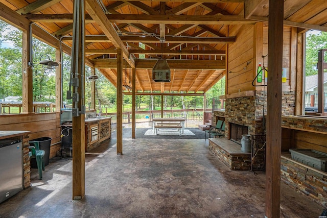 view of patio / terrace featuring an outdoor stone fireplace