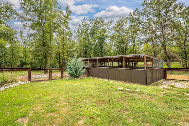 view of yard featuring an exterior structure and an outdoor structure