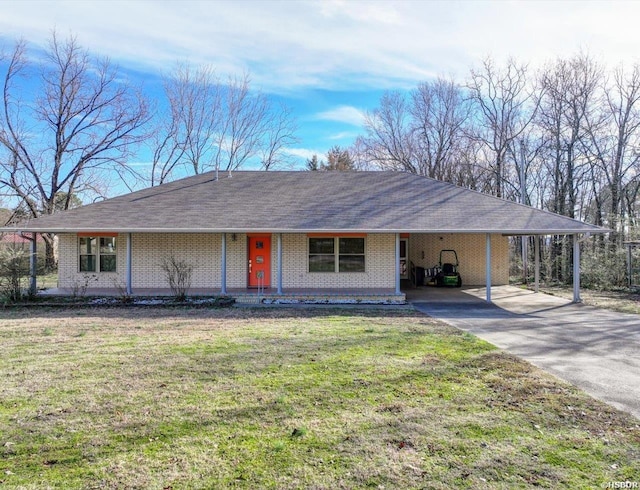 ranch-style house with a carport, a front yard, brick siding, and driveway