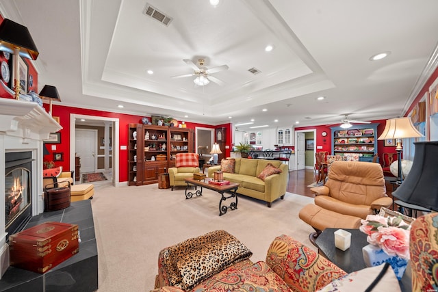 120 Southview Cir, Hot Springs, AR 71913 - carpeted living room with ceiling fan, a tray ceiling, recessed lighting, ornamental molding, and a glass covered fireplace