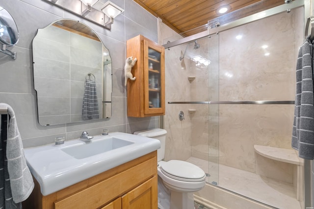 full bathroom featuring a stall shower, decorative backsplash, tile walls, and vanity